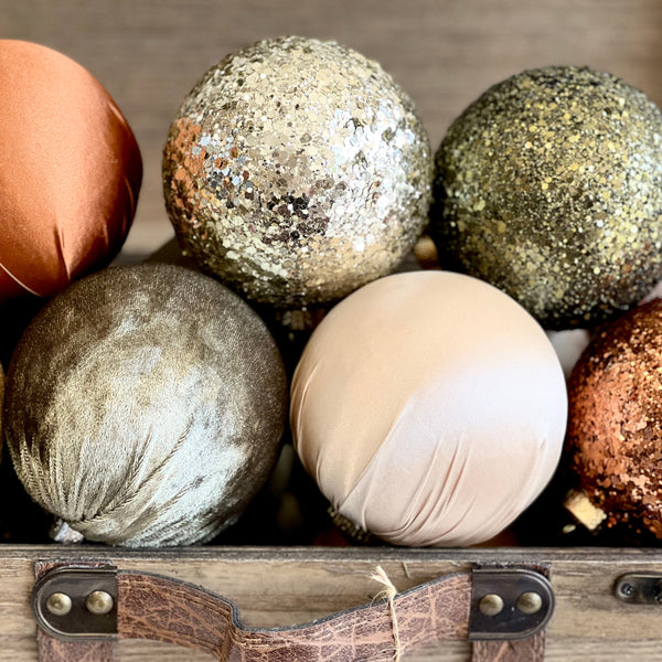 Christmas ornament set featuring satin, velvet, and glitter balls in gold, bronze, blush, olive, and ivory tones