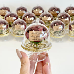 Decorative glass dome with a personalized message on a white background