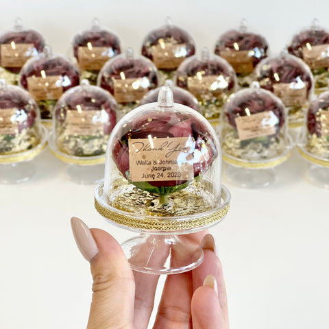 Decorative glass dome with a personalized message on a white background