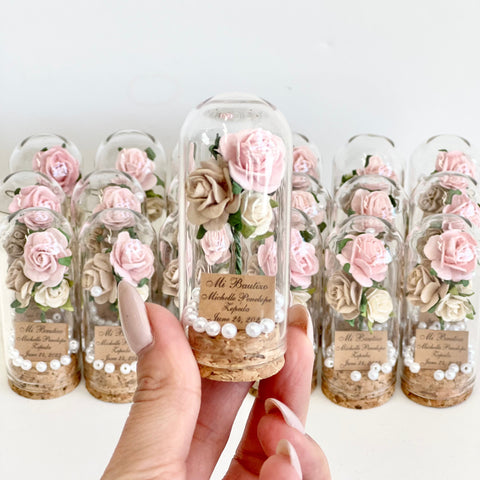 Decorative bottles with floral arrangements and text on a white background