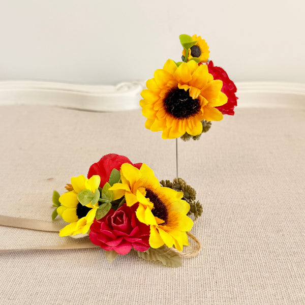 Floral hair clip with sunflowers and roses on a beige background
