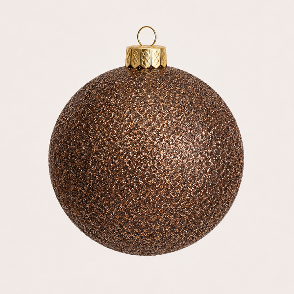 A spherical Christmas ornament covered in dense metallic bronze glitter, featuring a textured gold cap and a small hanging loop, set against a solid off-white background.