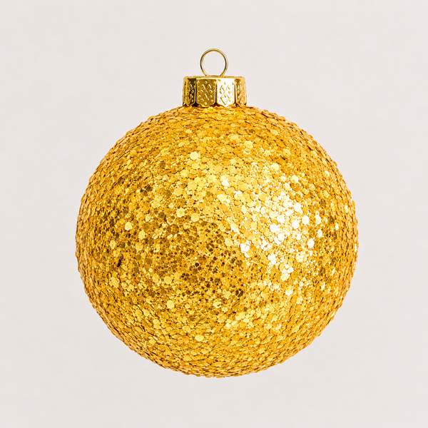 A round, gold glitter Christmas ornament with a metallic gold cap and hanging loop, shown against a light gray background.