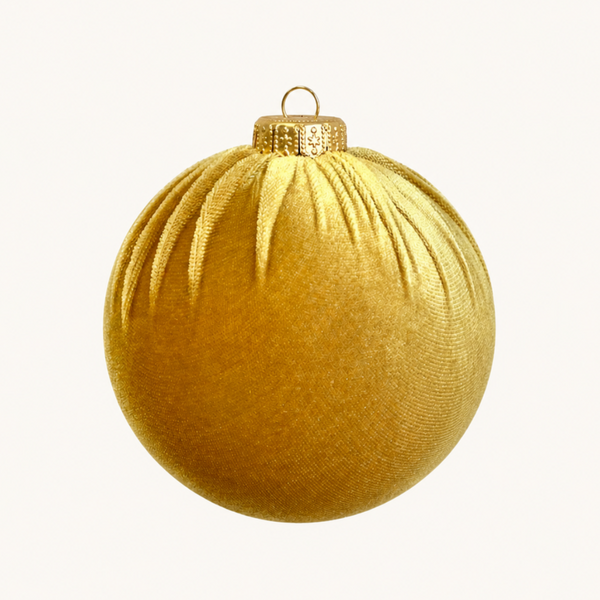 A single gold Christmas ornament shaped like a sphere with a textured fabric-like surface, featuring a small hanging loop at the top, isolated on a plain white background.