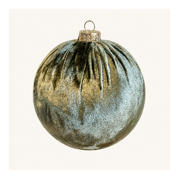 A metallic silver velvet Christmas bauble ornament with a gold cap and hanging loop, shown against a plain off-white background.