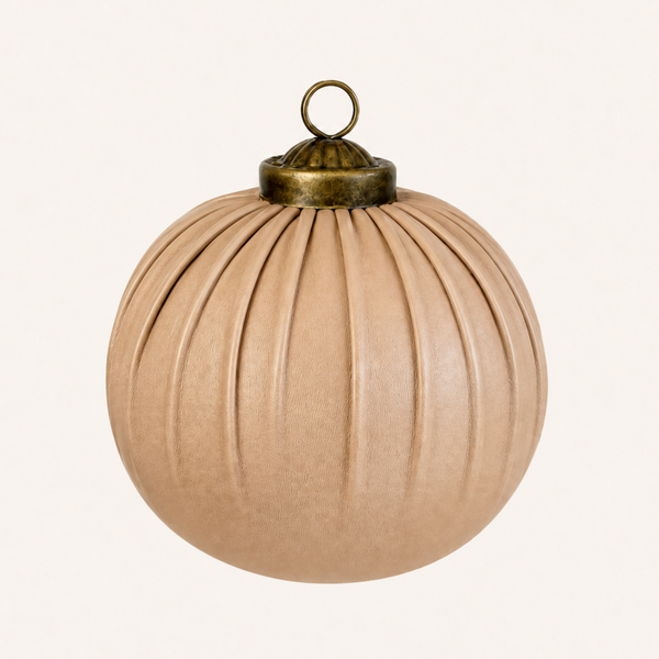 A pleated beige leather Christmas ornament with a brass hanging loop and cap, shown against a plain off-white background.