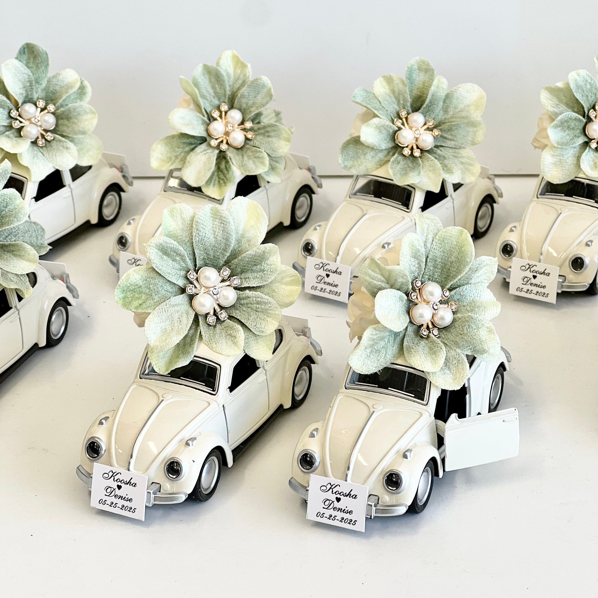 Decorative car models with floral elements on a white background