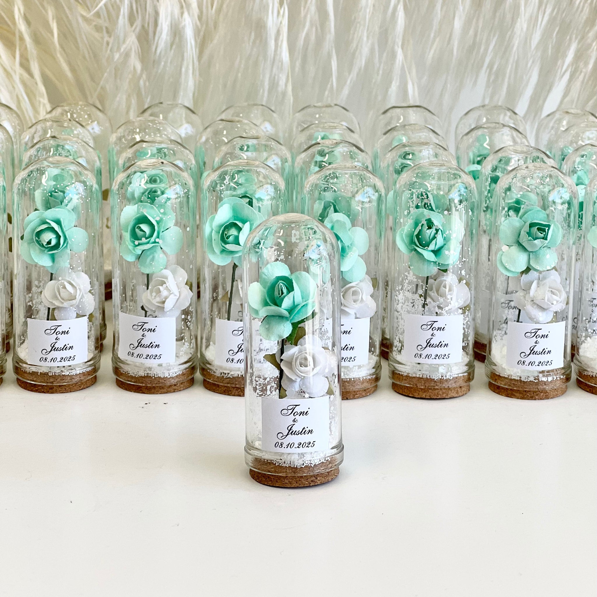 Decorative bottles with flowers and labels on a white background