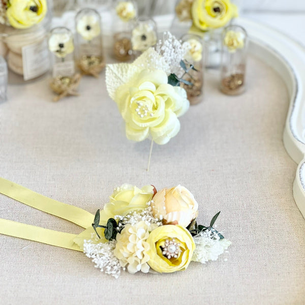 Yellow floral hair pins with decorative elements on a light background