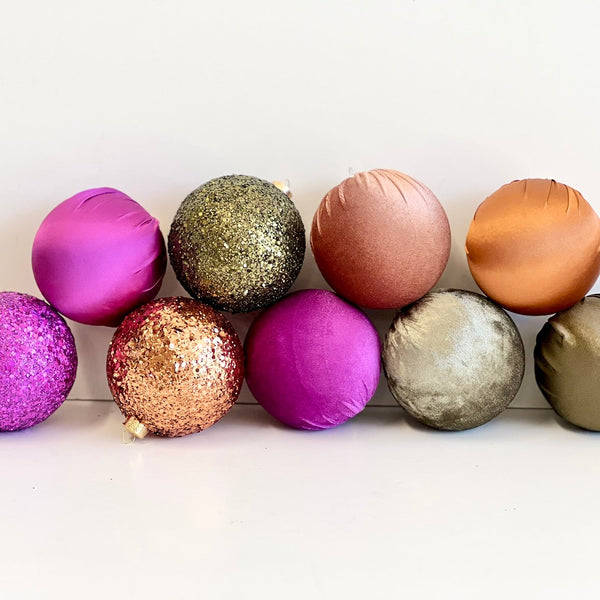 Decorative Christmas balls in various colors on a white background