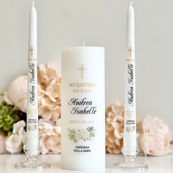 Personalized baptism candles with floral design on a light background